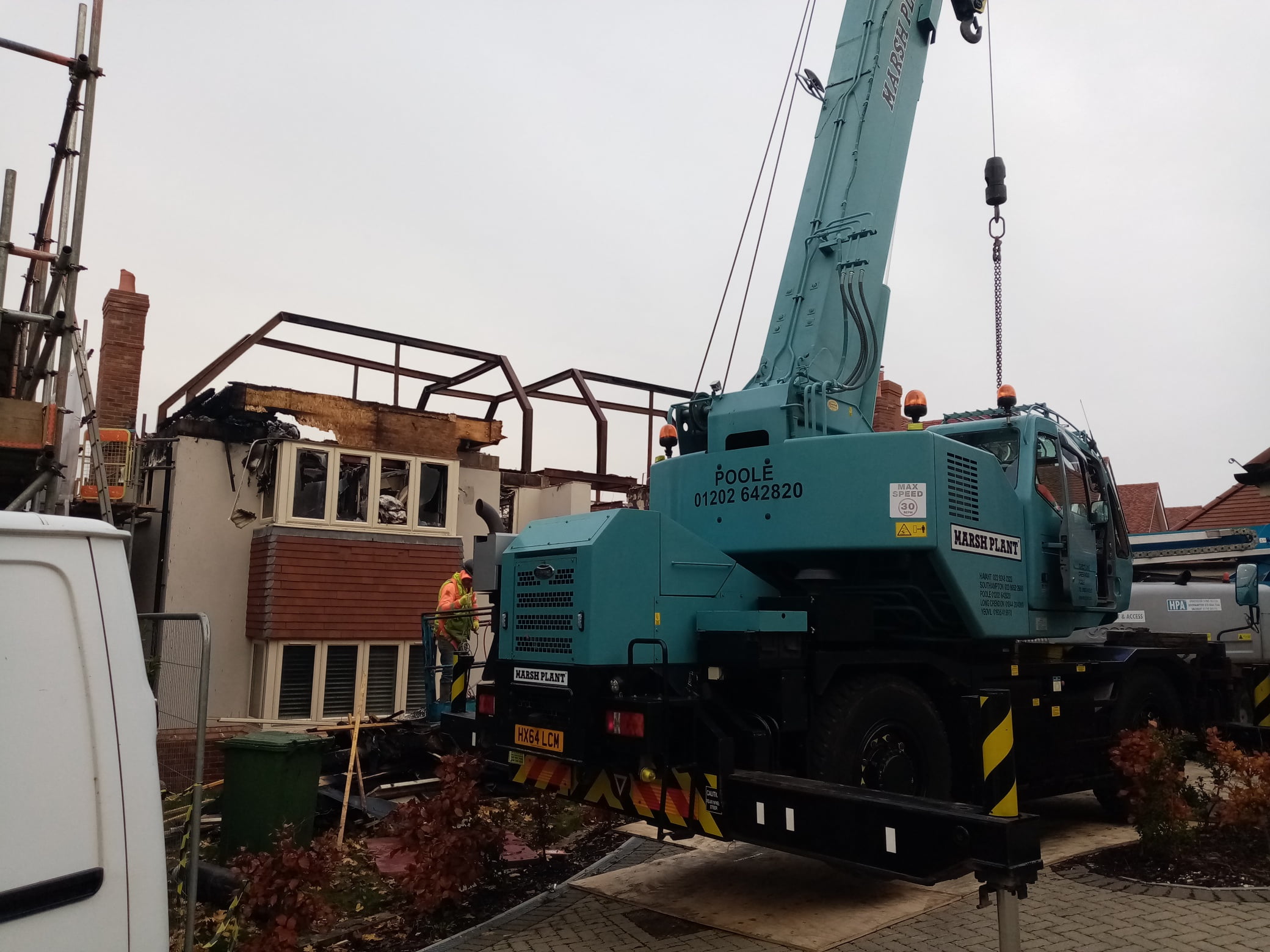 Demolition of a fire damaged house