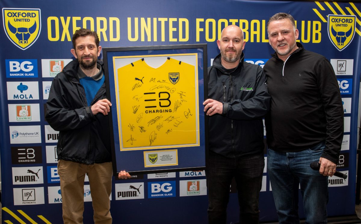 Jon and Rich from RJS Waste Oxford holding a signed shirt
