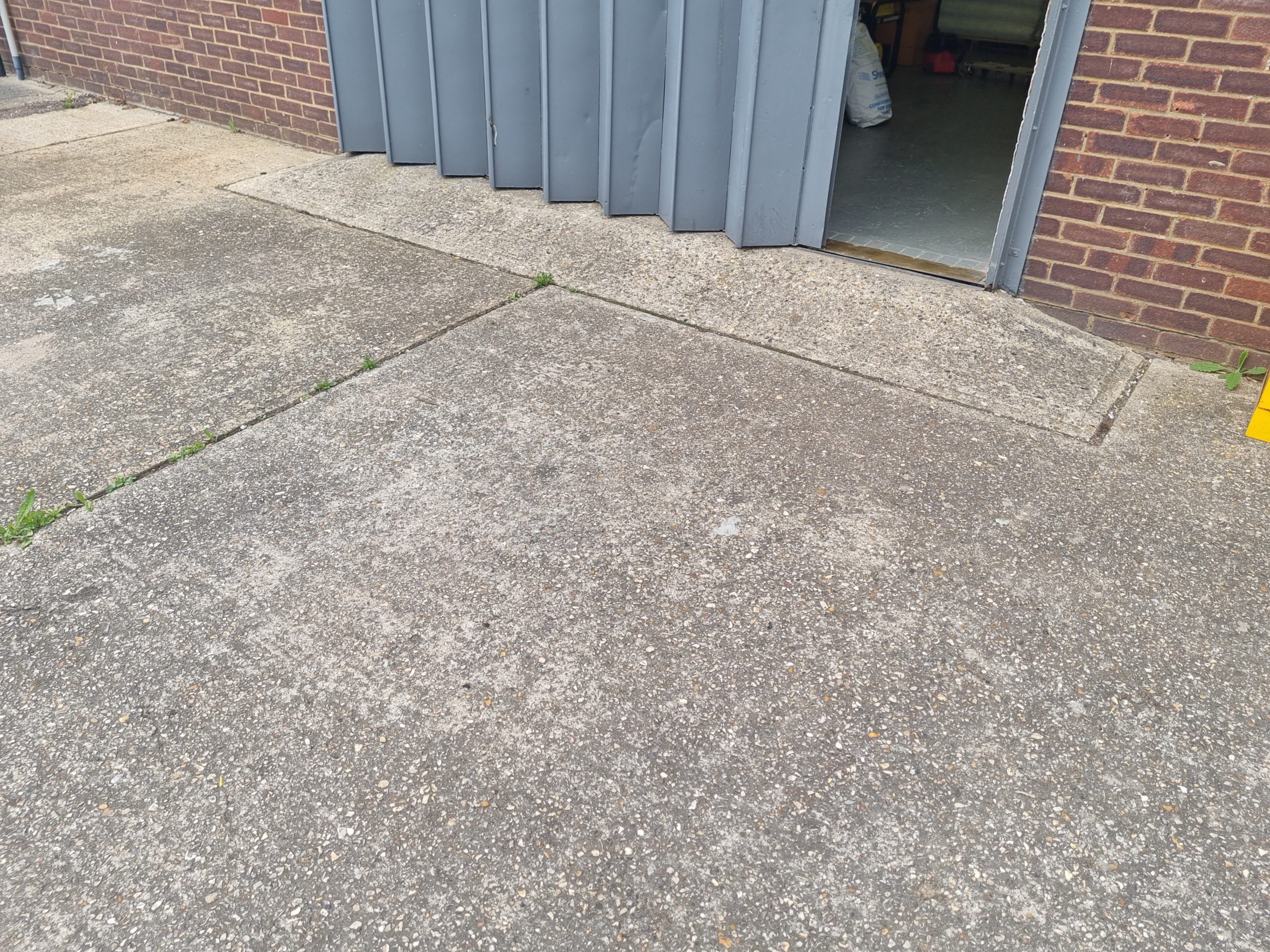 Before driveway cleaning – Our garage entrance