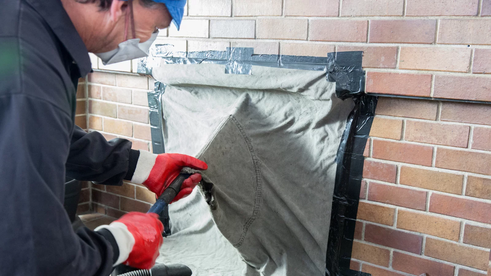 Workman wearing mask to protect himself from construction dust