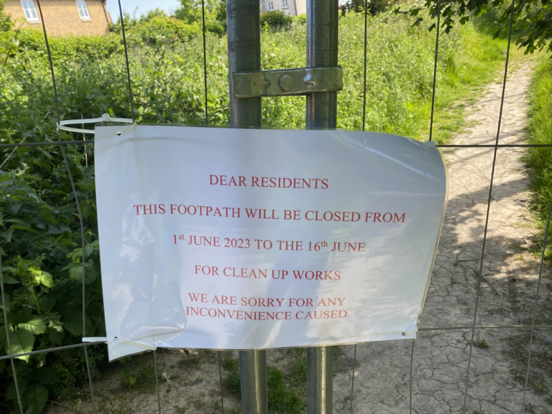 Sign on gate telling residents about site clearing and excavation works
