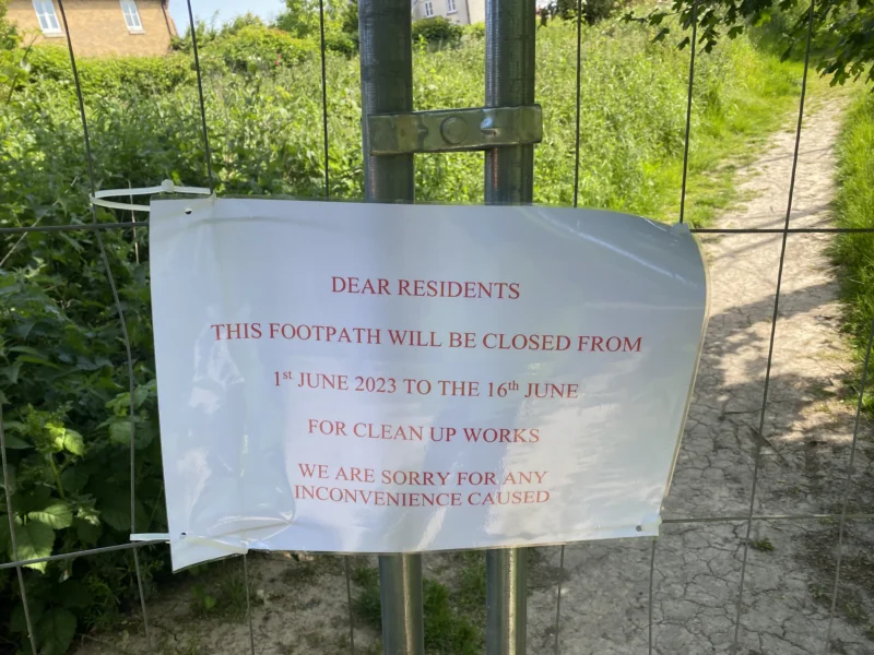 Sign on gate telling residents about site clearing and excavation works Sign on gate telling residents about site clearing and excavation works