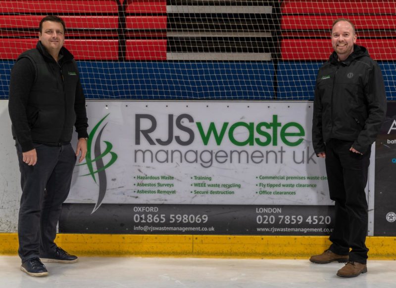 Russell Shrives and Tony Wells of RJS Waste Management Oxfordshire at an ice hockey match