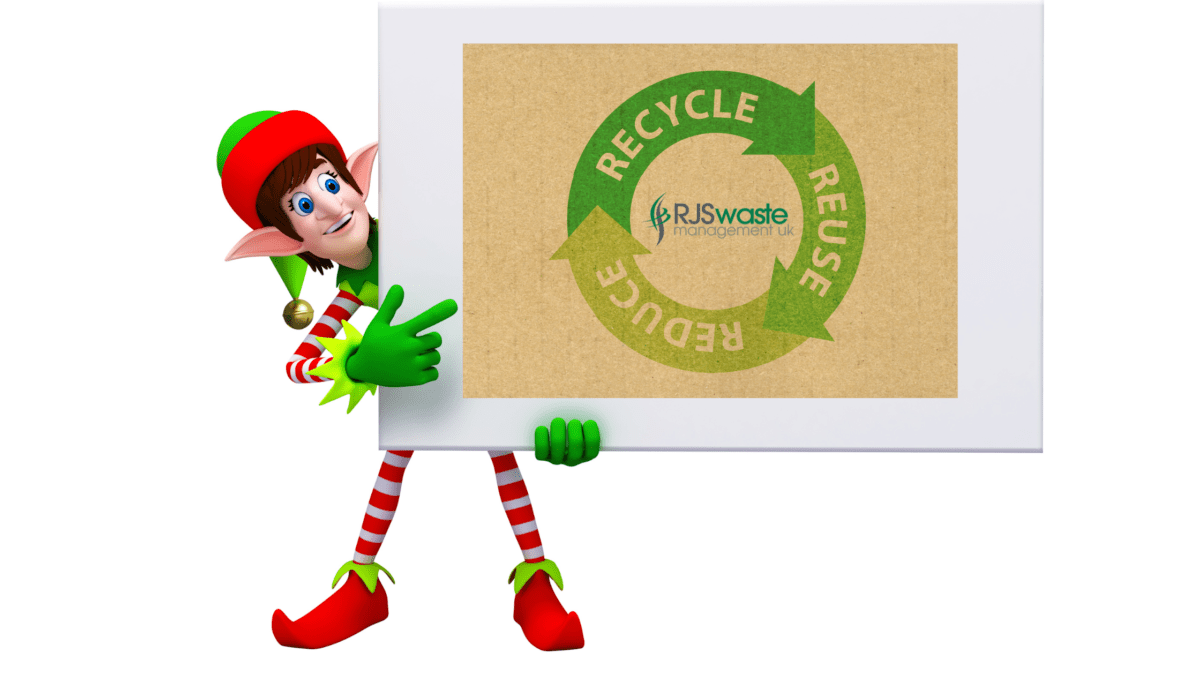 Christmas elf dressed in red and green, holding a business card that says the words Recycle, Reuse, Reduce and features the RJS Waste Management logo
