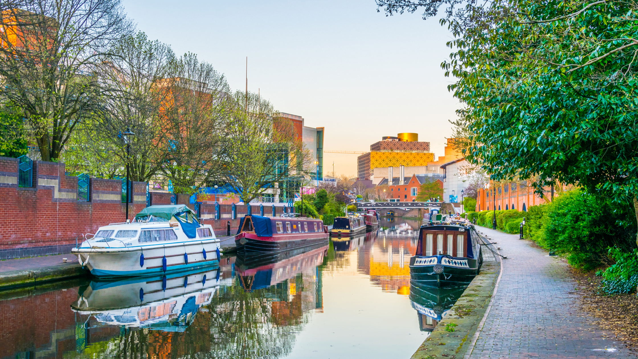 Sunset view of brick buildings and canal water channel in Birmingham