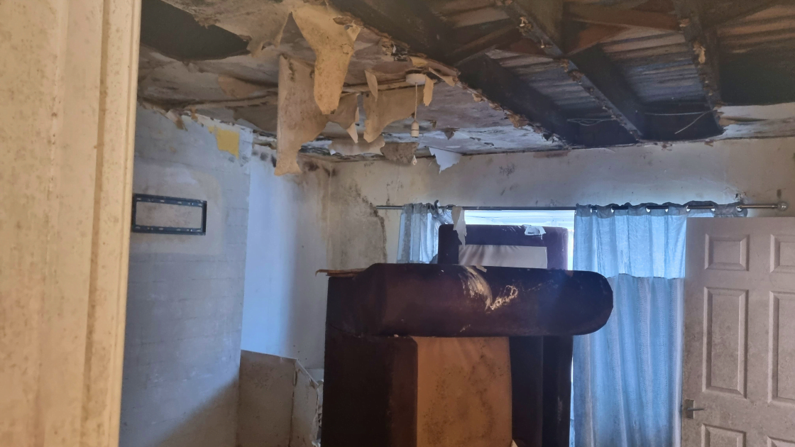Fire and water damage to the ceiling, fixtures and furniture in a Banbury home.