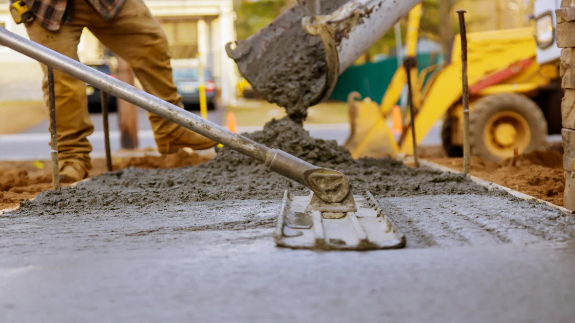 Cement being poured and laid Cement being poured and laid